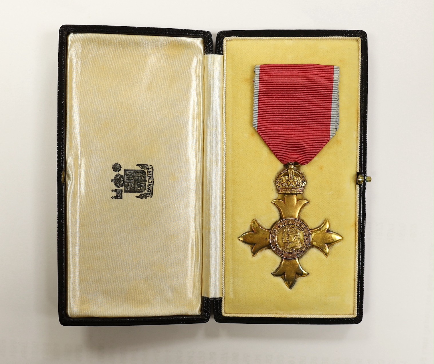 A cased O.B.E. Medal